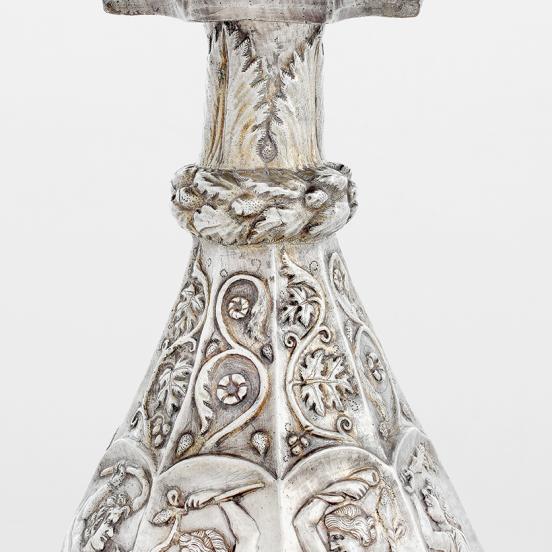 The ewer’s neck and shoulder decorated with an abundance of plants