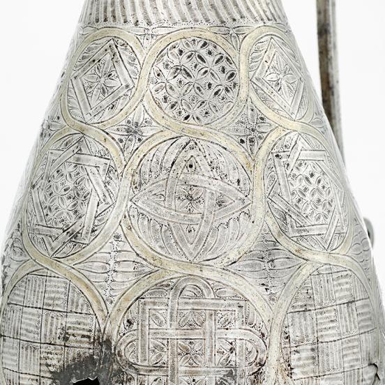 Openwork decoration and the thumbpiece on geometric ewer B