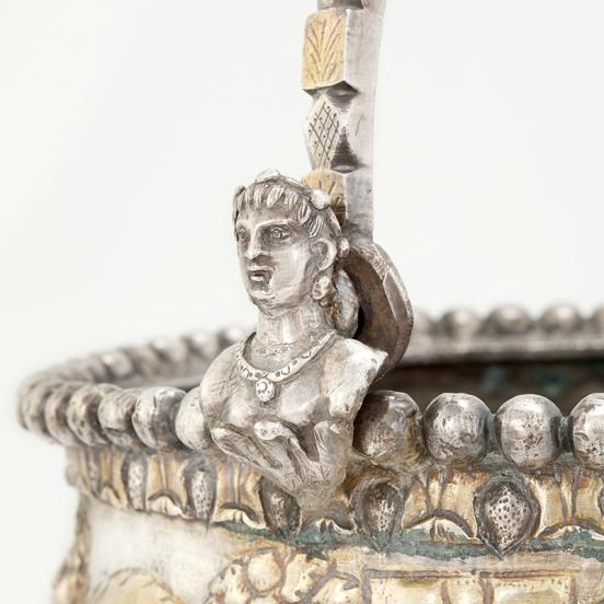 Male bust decorating the handle of situla A